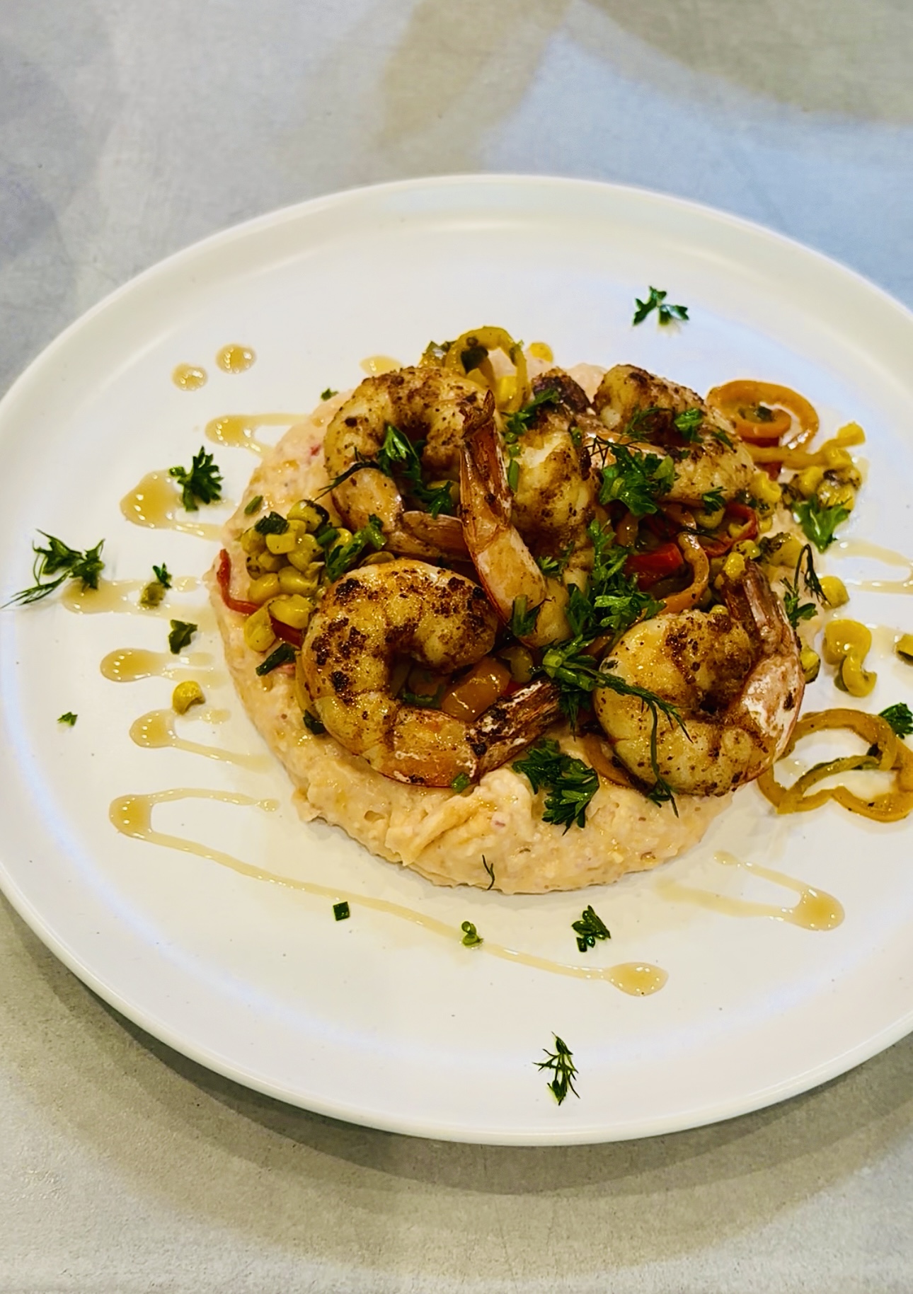 Blackened shrimp over creamy grits